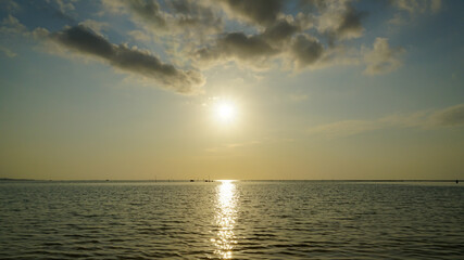 Beautiful sunset reflected on the surface of the sea