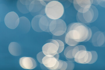 Abstract or blurry image of glitter or bokeh water of sea or ocean for background usage.