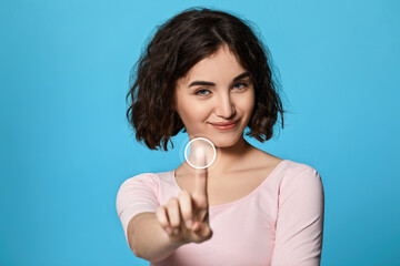 woman using touch screen on the blue background.