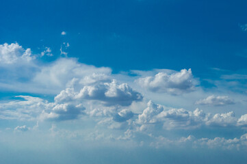 blue sky background with tiny clouds. panorama white fluffy clouds in the blue sky.Beautiful vast blue sky with amazing cloud background.Wide sky panorama with scattered cumulus clouds.