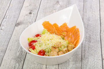 Caesar salad with fresh salmon