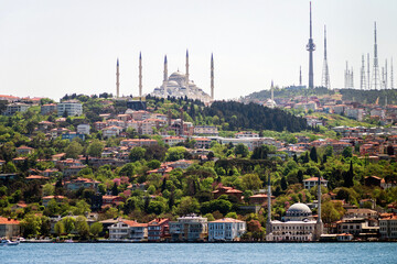 View from the Bosphorus to the largest mosque in Turkey, Grand Camlıca Mosque, and the Camlıca TRT Television Tower in Uskudar district of Istanbul, Turkey.