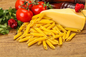 Raw penne rigate for cooking