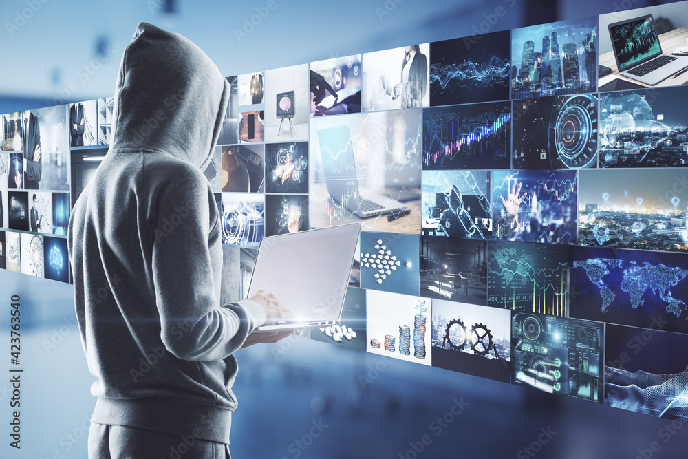 Poster content creation concept with guy in hoody with laptop and virtual all with video shots on backgroun