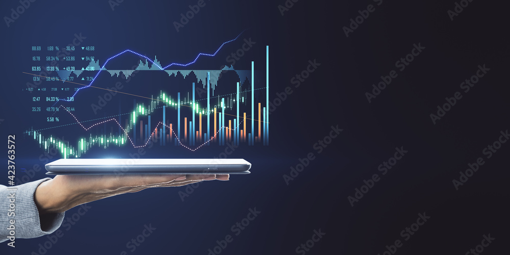 Poster Profitable investment concept with digital tablet on human hand with virtual interface with growing diagram and candlestick on dark blank backdrop. Mock up