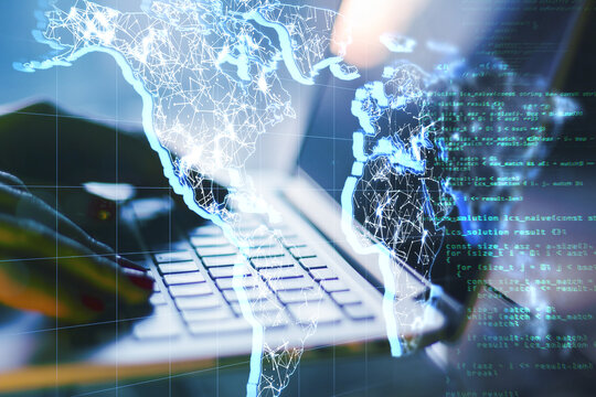 Communication technologies with digital world map and programming code on human hands typing on laptop keyboard background - Powered by Adobe