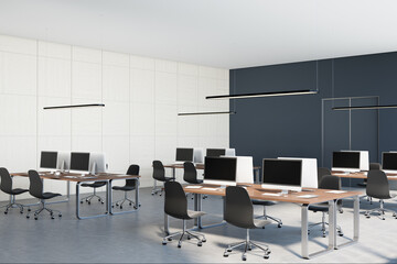 Monochrome style interior design of open space office with black and white walls, concrete floor, wooden tables and black chairs