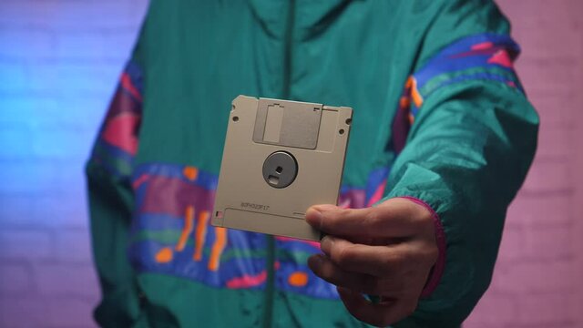 Showing a diskette floppy disk up close. 80s 90s style