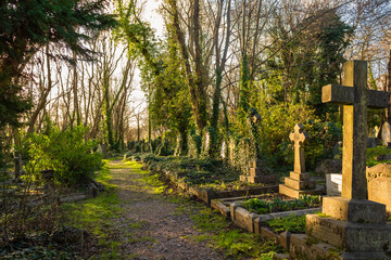 cross in the cemetery in spring