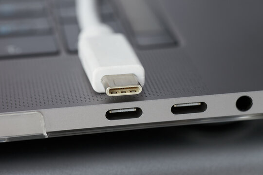 Close-up photo of laptop type-c ports, type-c cable and 3.5 jack.