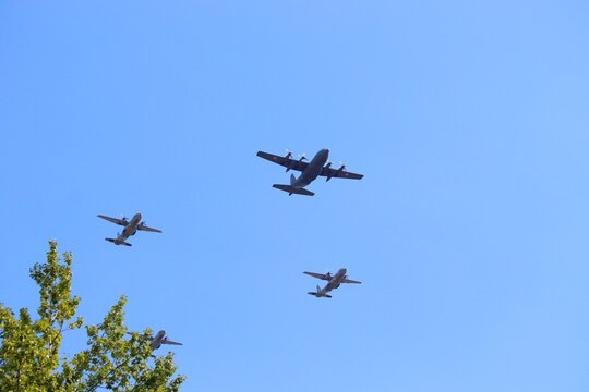 KATOWICE, POLAND - AUGUST 15, 2019: Air show for Armed Forces Day in Katowice, Poland. Lockheed C-130 Hercules and Casa C-295 transport aircraft flying over Katowice.