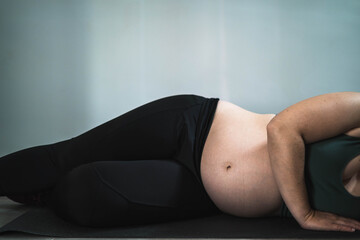 Pregnant woman doing pilates