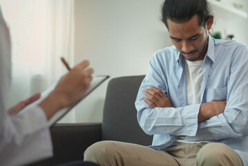 Men talk with a psychologist during talking therapy stressed mental health at office