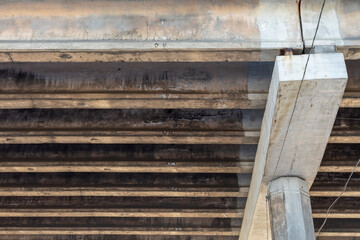 Reinforced Concrete Structure of Highway Overpass. Cracking of concrete beams under the bridge....