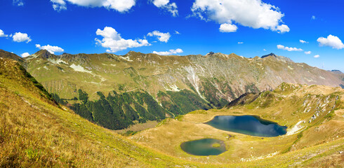 landscape panorama of top mountains and lake