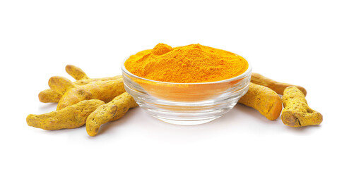Bowl with turmeric powder and roots on white background