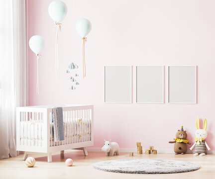 Blank poster frames mock up on pink wall in nursery room interior background with baby bedding, soft toys, balloons, 3d rendering