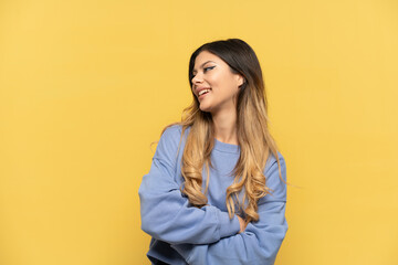 Fototapeta premium Young Russian girl isolated on yellow background happy and smiling