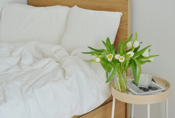 bouquet of white flowers and bed