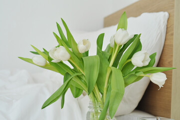 bouquet of white flowers and bed