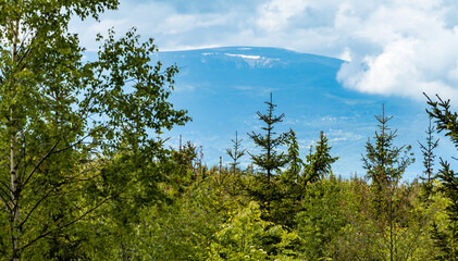 Panorama of Karkonosze Giant Mountains in clouds seen from Rudawy Janowickie