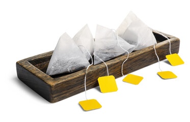 Tray with tea bags on white background
