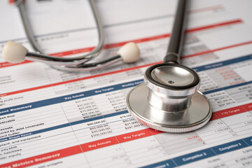 Stethoscope on spreadsheet paper, Finance, Account, Statistics, Investment, Analytic research data economy spreadsheet and Business company concept.