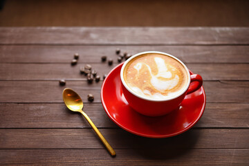 Cup of coffee with latte art on table