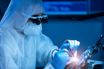 Microelectronics engineer works in a modern scientific laboratory on computing systems and...