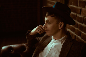 thoughtful person in hat