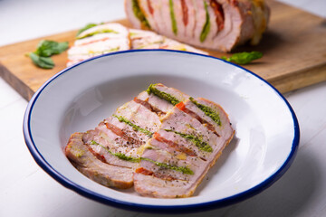 Italian-style stuffed tenderloin with tomato, mozzarella and pesto