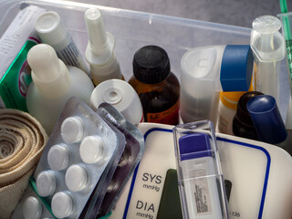 Tablets, inhalers, spray, tonometer, thermometer and other medical items are in the medicine...