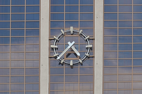 Clock on the glass facade of the building.