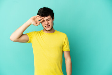 Fototapeta premium Young Russian man isolated on blue background with tired and sick expression