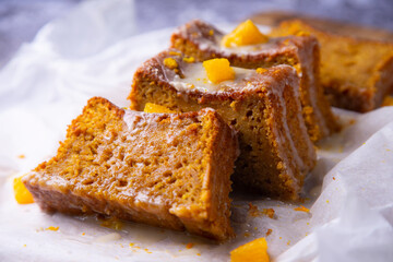 Vegan whole grain orange sponge cake with sugar glaze