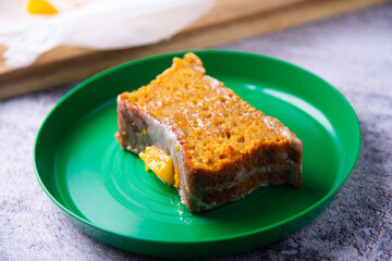 Vegan whole grain orange sponge cake with sugar glaze