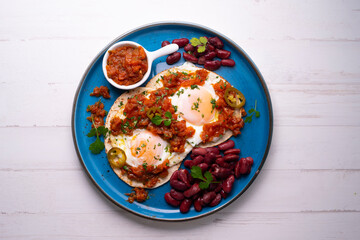 Huevos rancheros with red beans