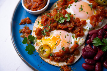Huevos rancheros with red beans