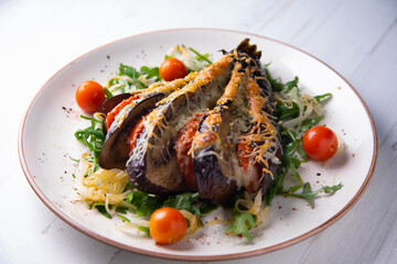 Hasselback Eggplant stuffed with tomato Italian style with cheese