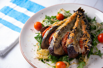 Hasselback Eggplant stuffed with tomato Italian style with cheese