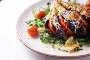 Hasselback Eggplant stuffed with tomato Italian style with cheese