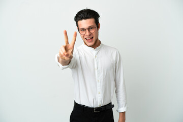 Fototapeta premium Russian Business man isolated on white background smiling and showing victory sign