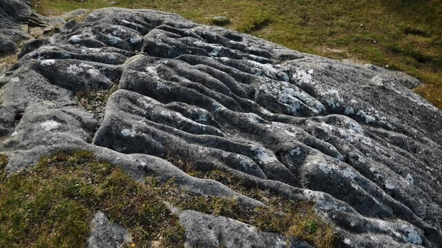 Aerial top down showing rocky castle hill boulders during sunny day in New Zealand.