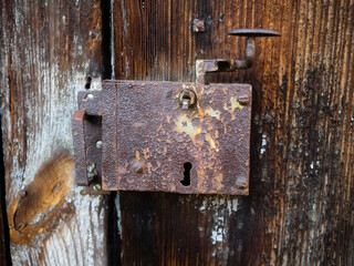old rusty padlock on door