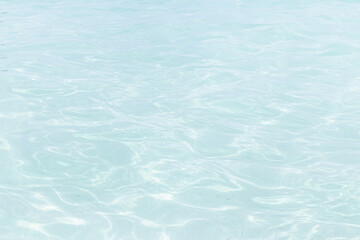 Shining blue water ripple background
