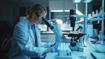 Medical Research Scientist Looks at Biological Samples Under Digital Microscope in Applied Science...