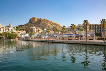 Waterfront and marina of the seaside city with Mount Benacantil, and the Castle of Santa Barbara in the background, Alicante, Costa Blanca, Spain.