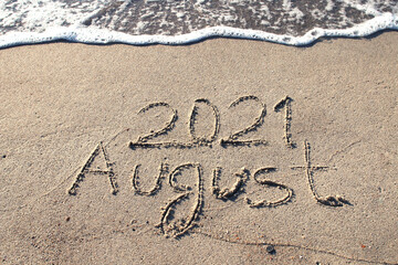 AUGUST 2018 on a gentle beach sand