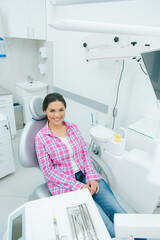Comfortable dental office with happy female patient
