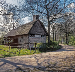 Fototapeta na wymiar Traditional historic farms at Open air museum Orvelte Westerbork Drenthe Netherlands. Barn. Reed roof.